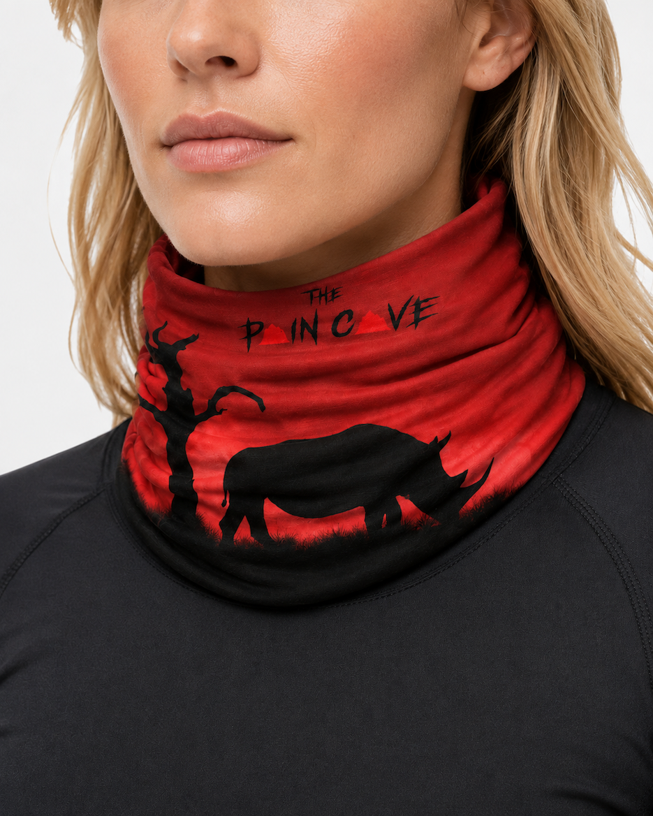blonde lady wearing the Pain Cave rhino snood/buff around her neck as a neck gaiter.